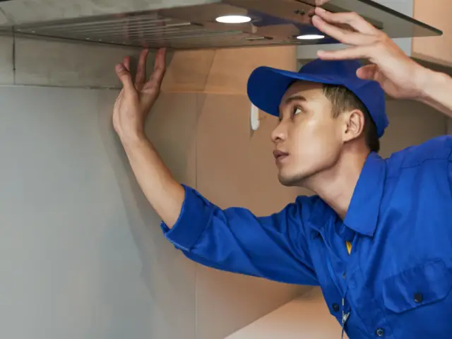 A contractor cleaning air ducts